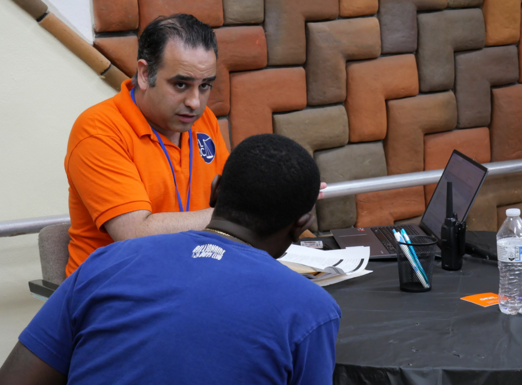 Florida Justice Center Director of Legal Services, Alex Saiz, Esq. discusses expungement with a client