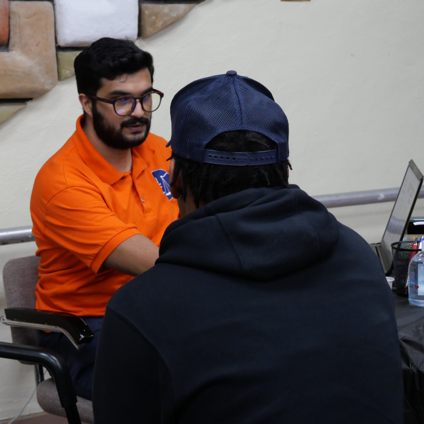 Staff Attorney Zubin Kapadia discusses voting eligibility with a client